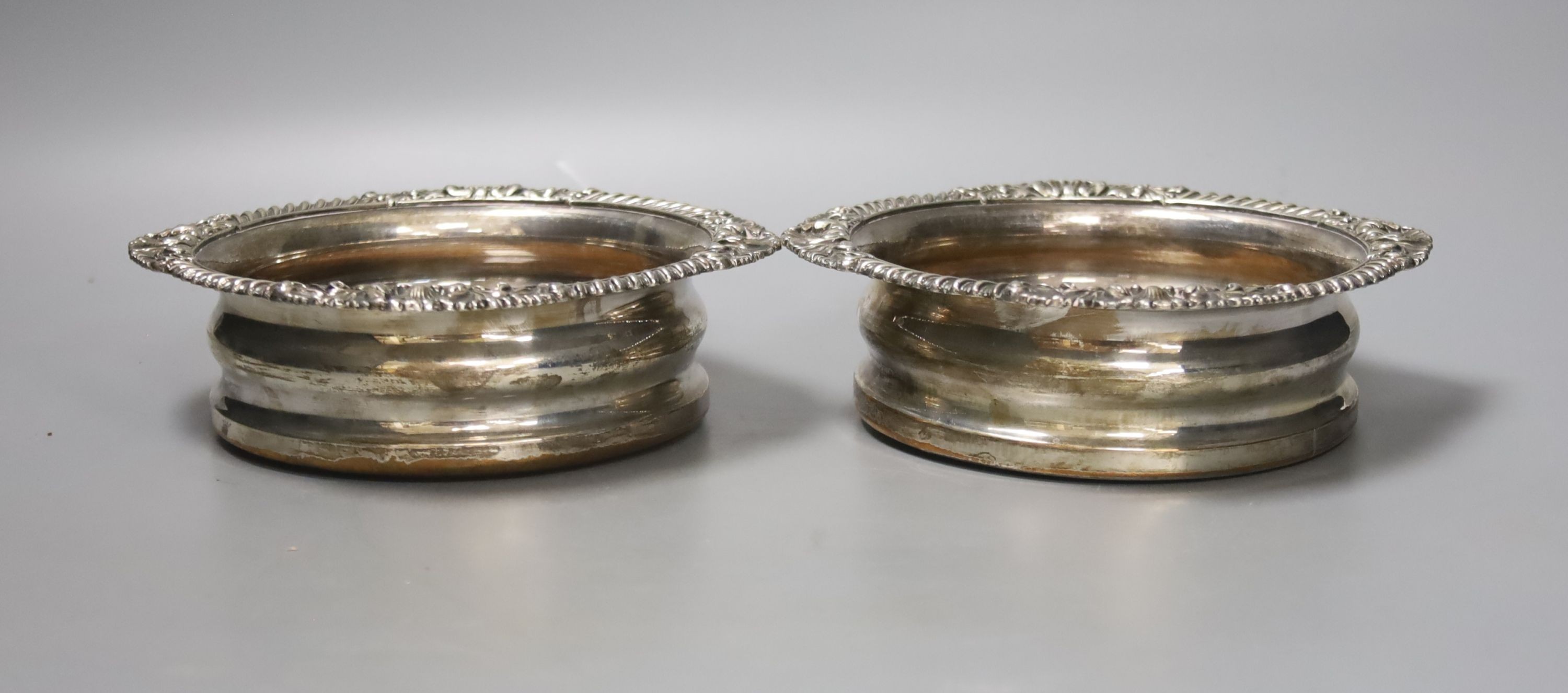 A pair of Victorian plated wine coasters, largest 17cm